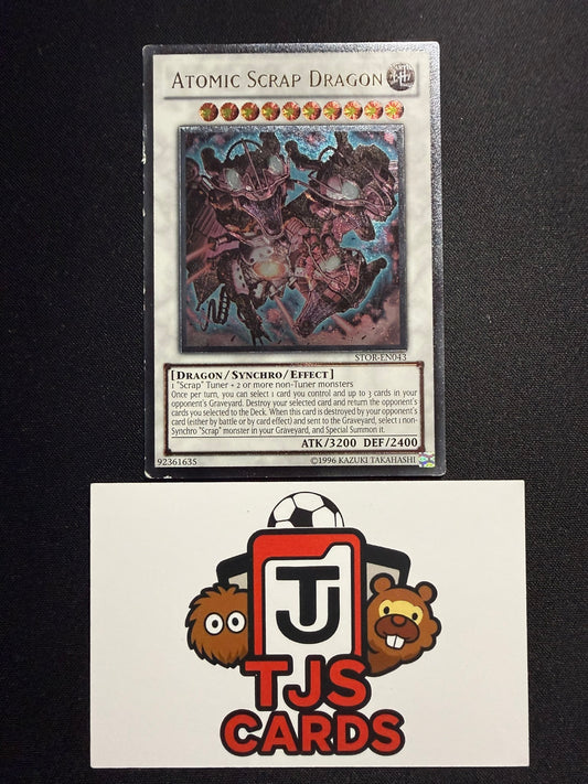 Atomic Scrap Dragon - Ultimate Rare STOR-EN043 - MP - YuGiOh