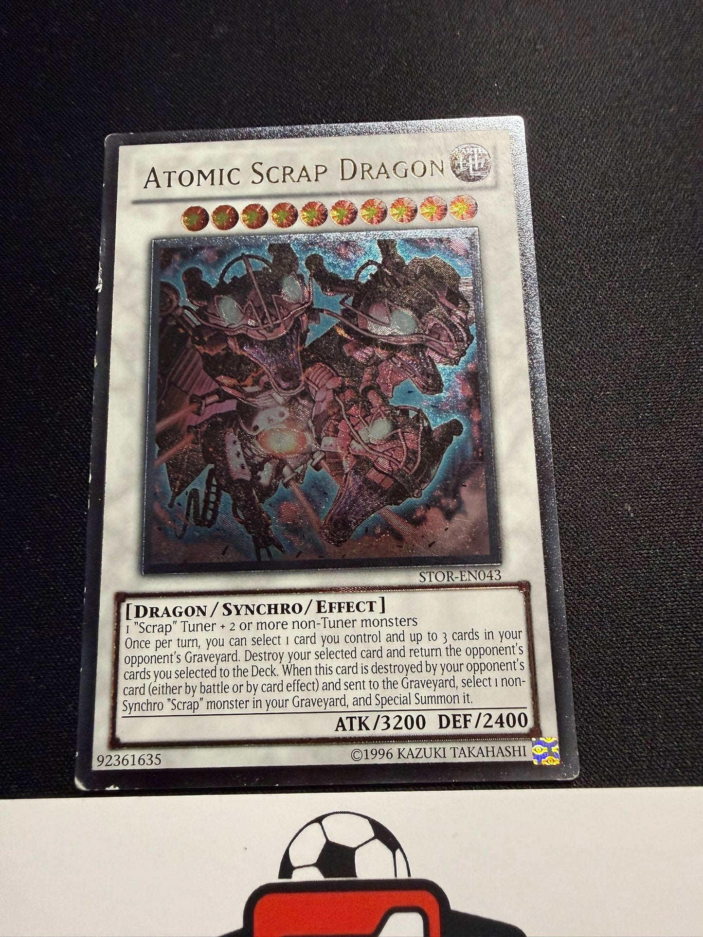 Atomic Scrap Dragon - Ultimate Rare STOR-EN043 - MP - YuGiOh